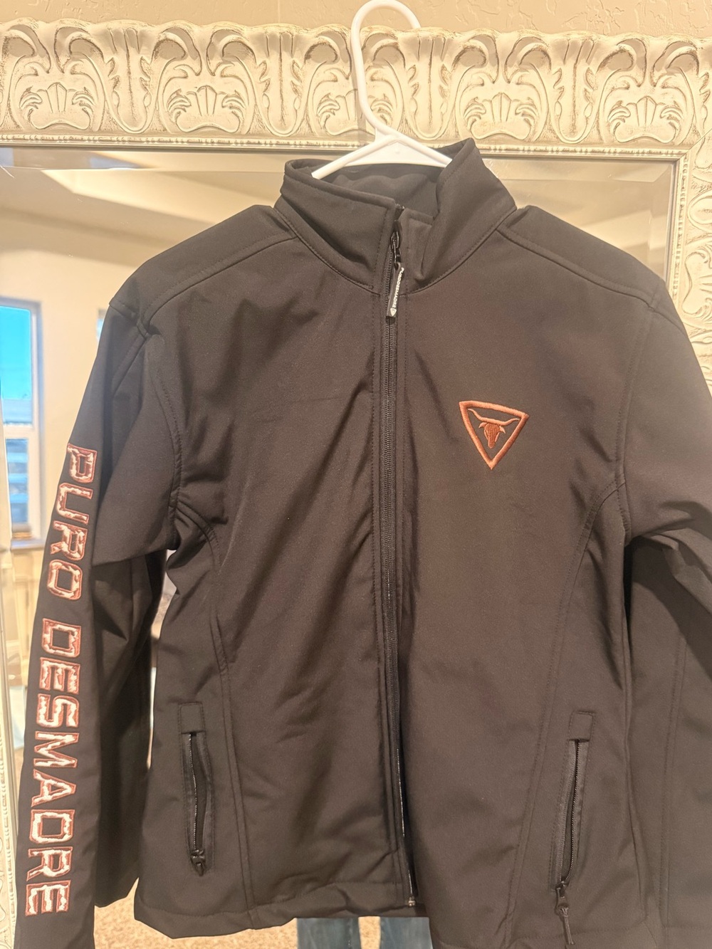 Puro Desmadre black jacket with bull on the back